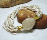 Women bracelet beige beads strands